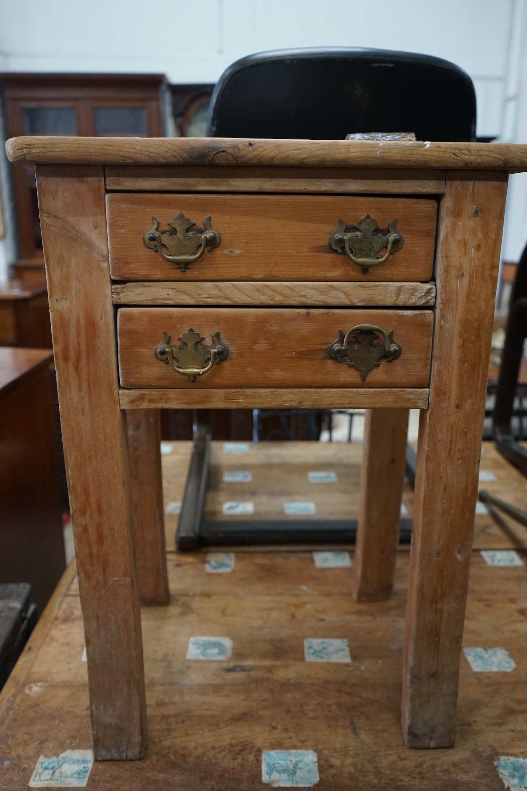 A Victorian pine two drawer book press table, width 50cm, depth 36cm, height 71cm